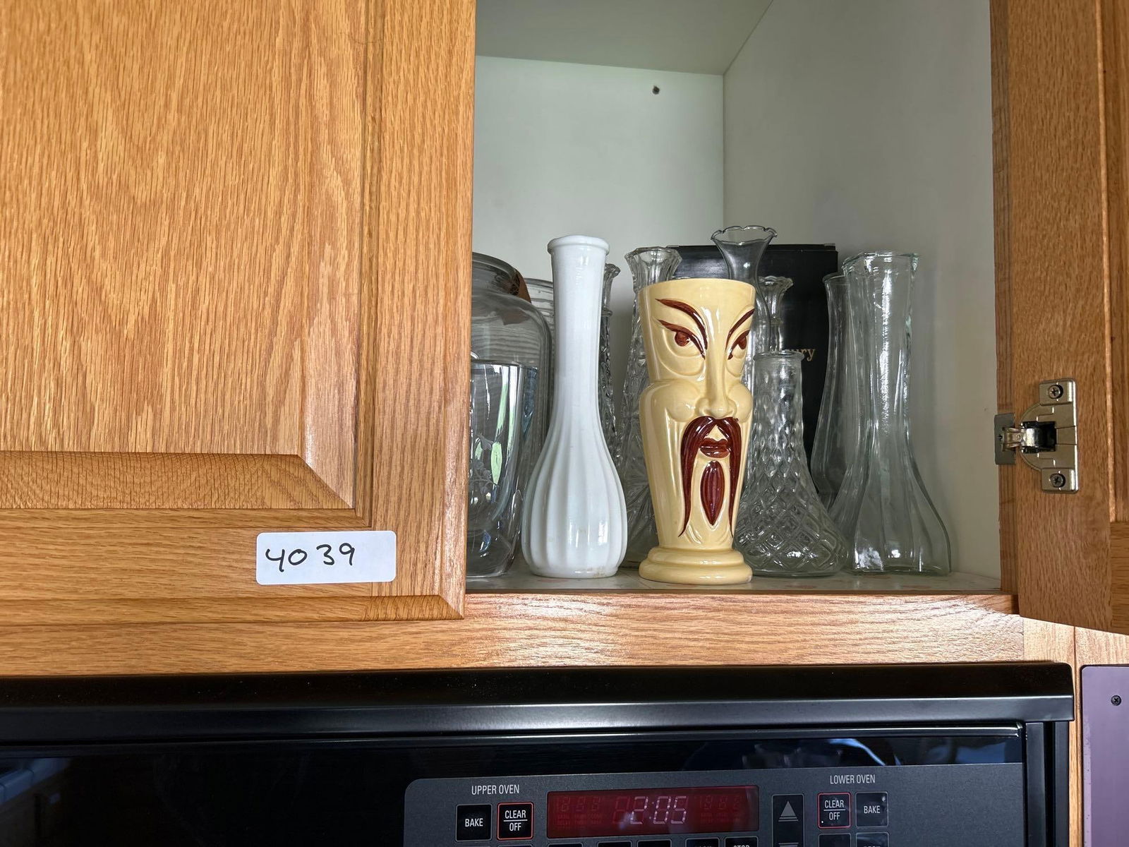 Cupboard Of Vintage Vases, Peanut Jar, And Crystal, Including Roseville: Cupboard of vintage vases, peanut jar, and Crystal, including Roseville.