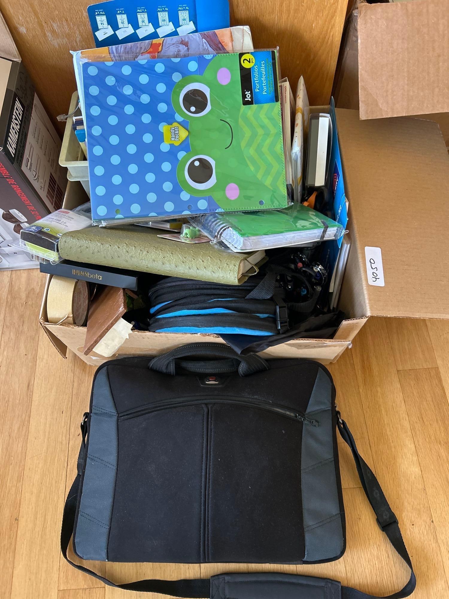 Large Box Of Office Supplies And Laptop Bag: Large box of office supplies and laptop bag.