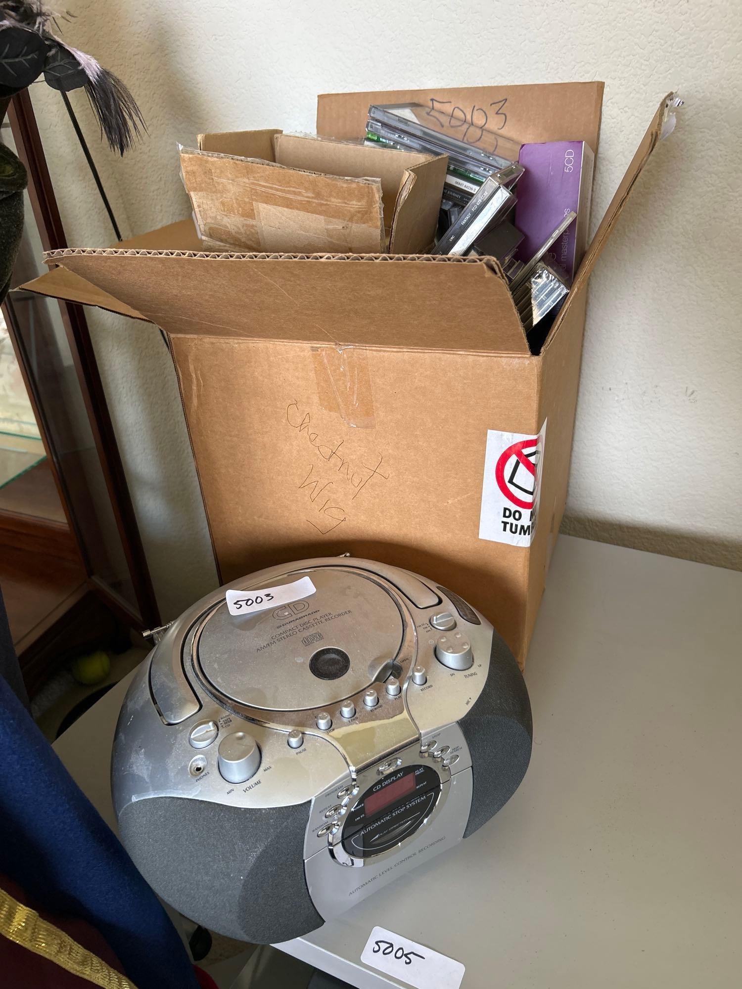 Durabrand Cd Player With Large Lot Of Cds: Durabrand CD player with large lot of CDs.