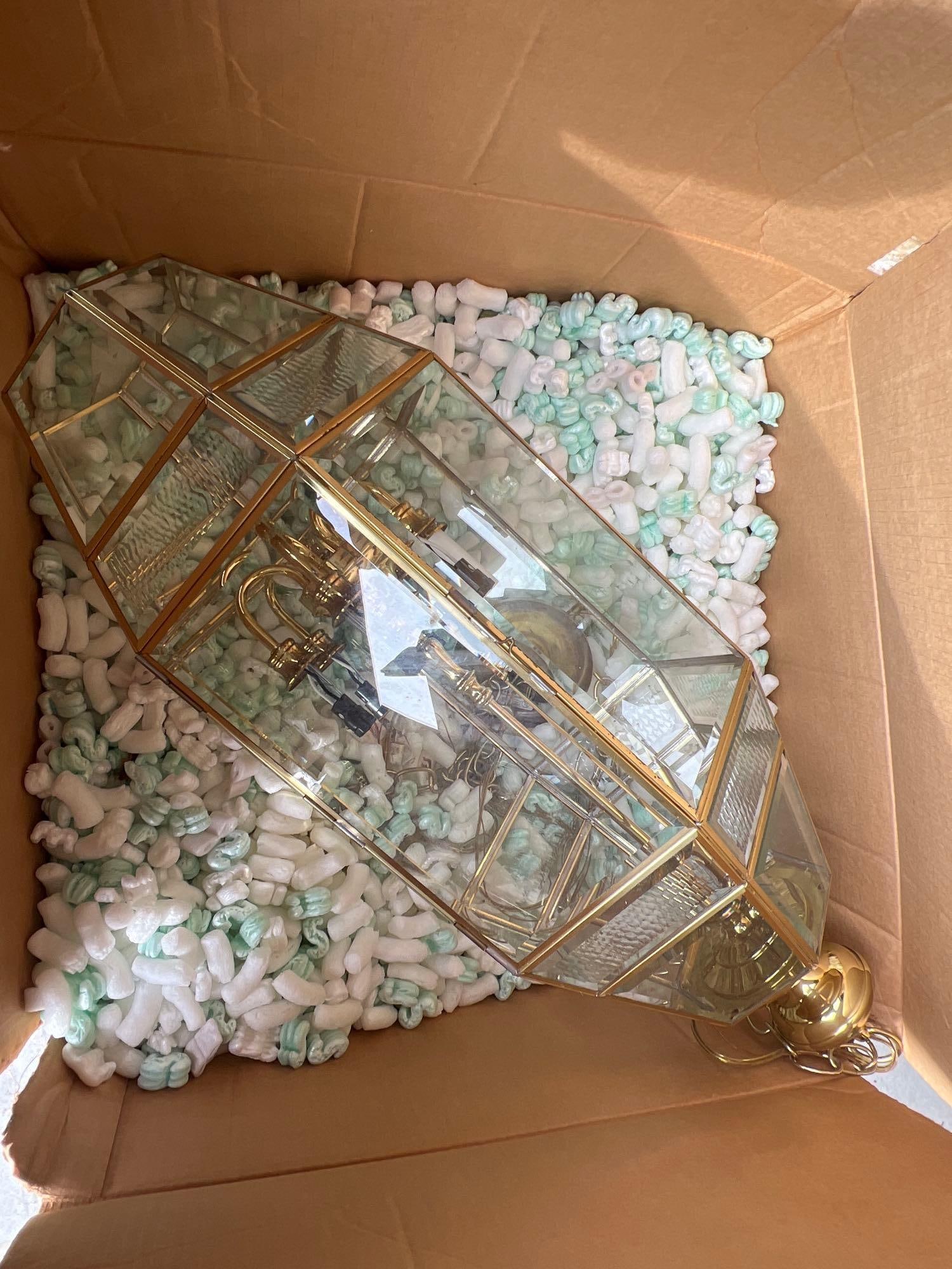 Large Brass Mounted Beveled Glass Six Light Pendant Lamp: Large brass mounted beveled glass Six light pendant lamp. Approximately 32in long, excluding chain.