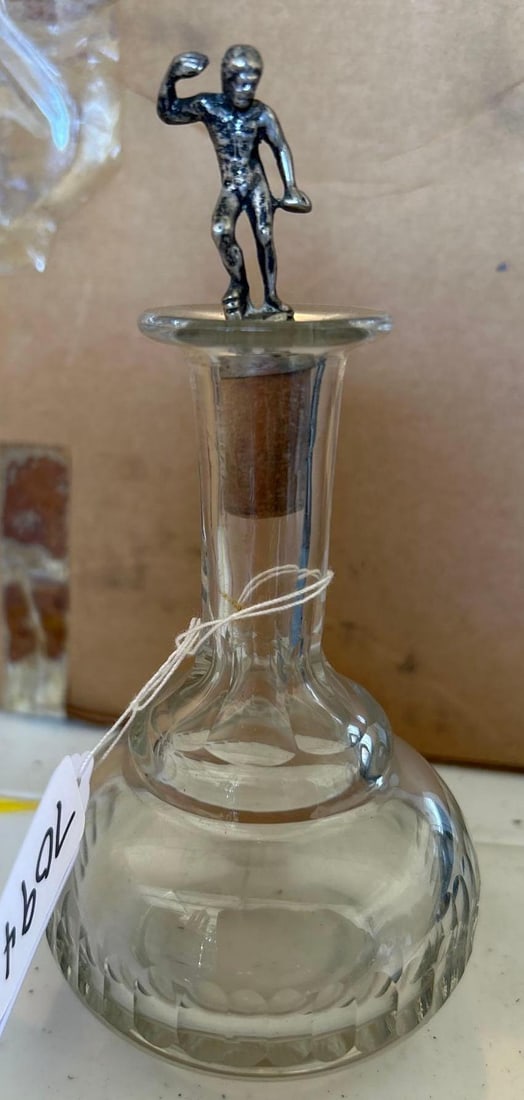 Antique Glass Perfume Bottle With Figural Sterling Silver Stopper: Antique glass perfume bottle with figural sterling silver stopper. Approximately 6.0H x 3.0W in.