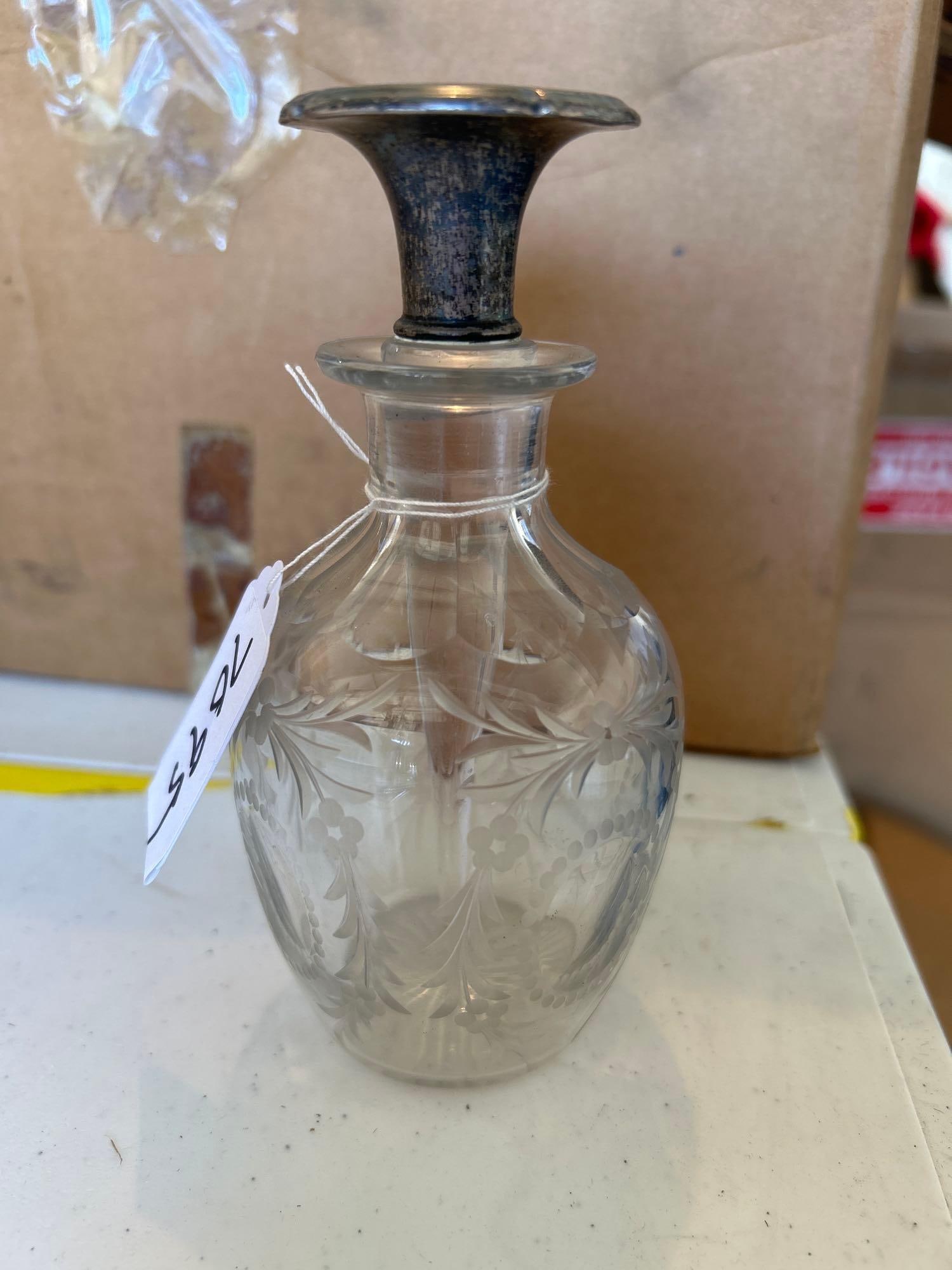 Antique Etched Glass Perfume Bottle With Sterling Silver Stopper: Antique etched glass perfume bottle with sterling silver stopper. Approximately 5.5H x 2.75W in.