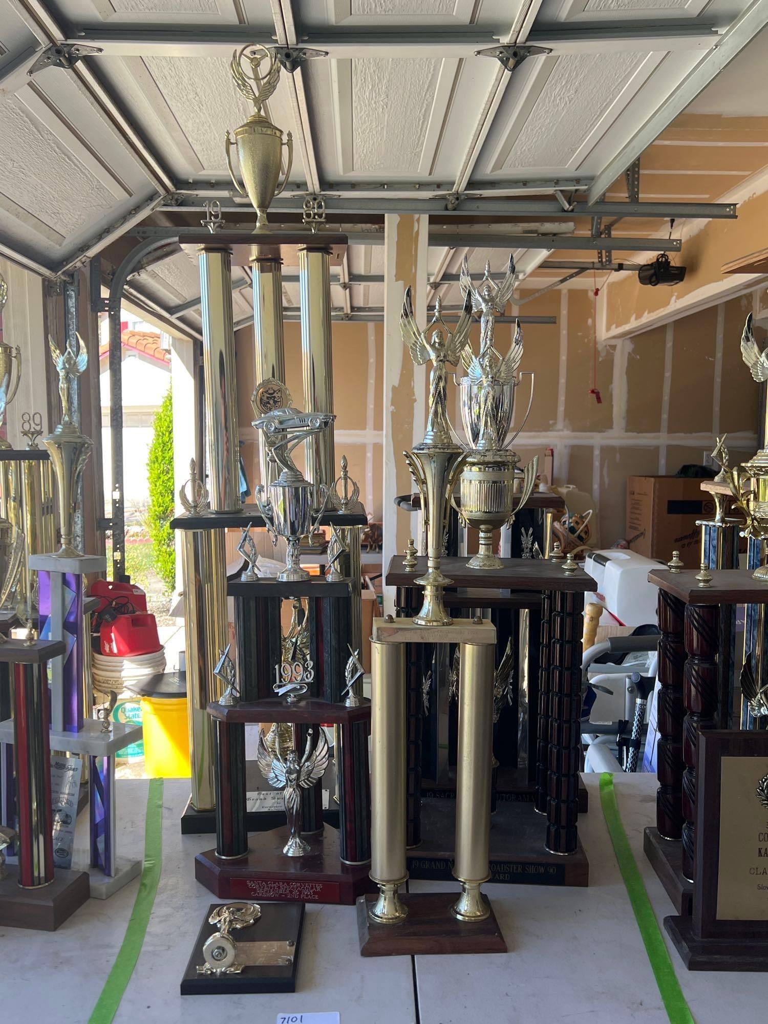Lot Of Vintage Car Trophies: Lot of vintage car trophies. Largest approximately 49.0in high.