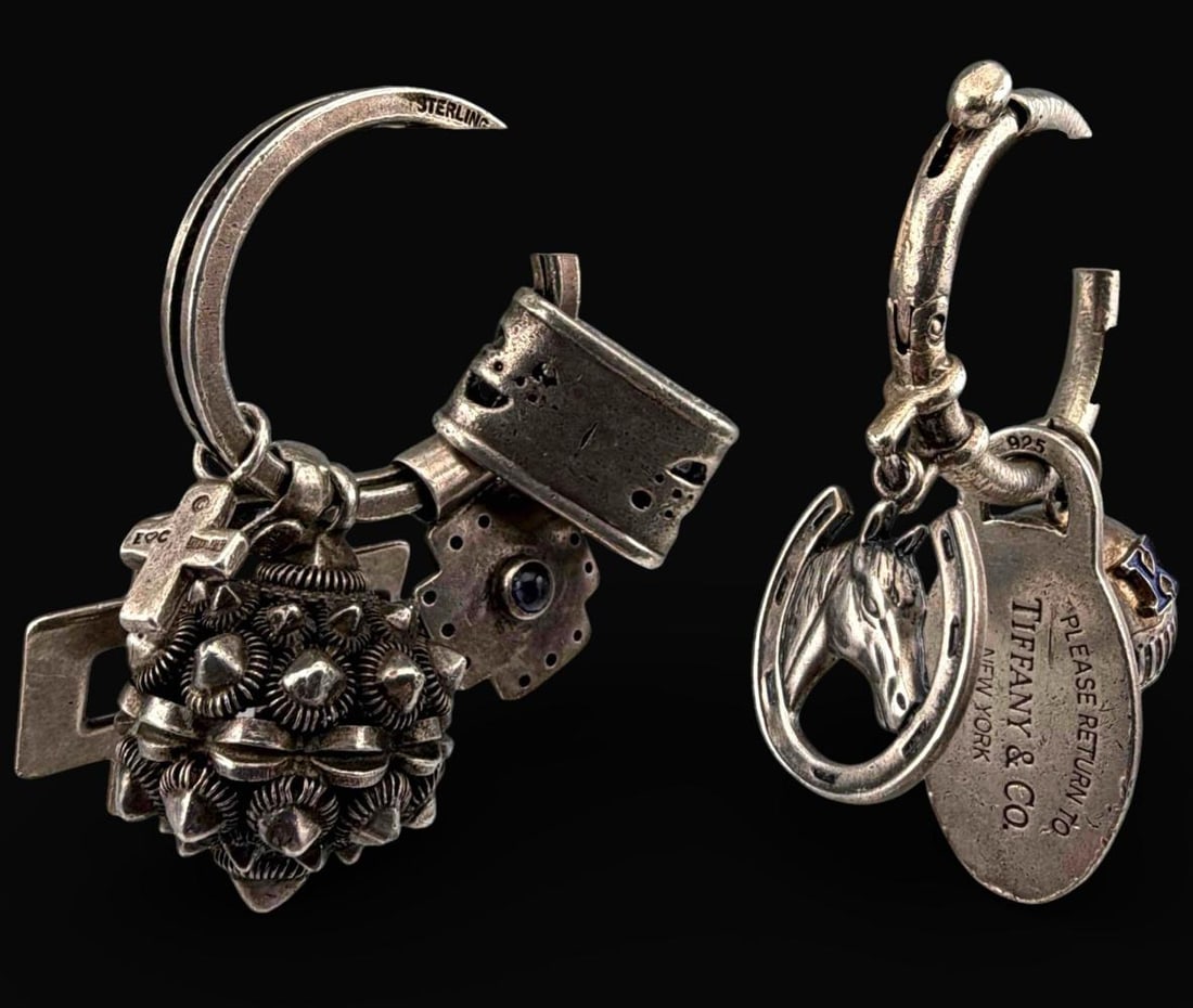 Sterling Silver Key Rings & Charms, Including Tiffany & Co.: Sterling Silver Key Rings & Charms, Including Tiffany & Co., 59.6g total weight. Pieces marked or test as Sterling. Please Return to Tiffany & Co. charm approximately 34.6 x 17.0mm. Wire work ball