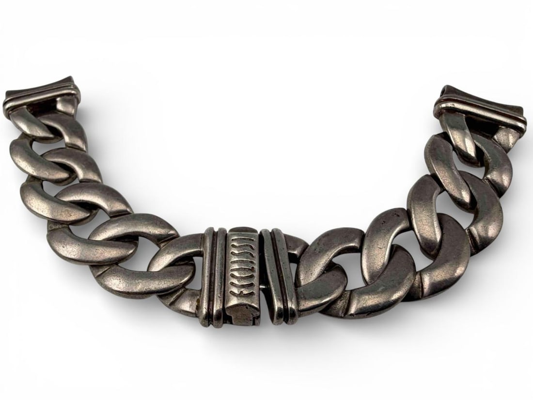 Sterling Silver Curb Chain Watch Band: Sterling Silver Curb Chain Watch Band, 60.3g. Marked "925." Length approximately 6.5in. Width approximately 16.6mm. Provenance: From the private collection of Joel Rothschild.