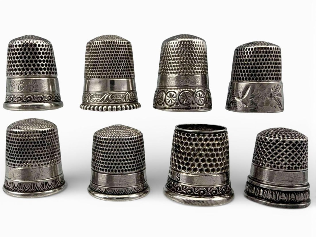 Eight Sterling Silver Thimbles: Eight Sterling Silver Thimbles, 29.5g. Marked or test as sterling. Largest approximately 22.0H x 18.7W mm. Smallest approximately 17.4H x 15.2W mm. ALL CREDIT CARDS WILL BE MANUALLY VERIFIED PRIOR TO