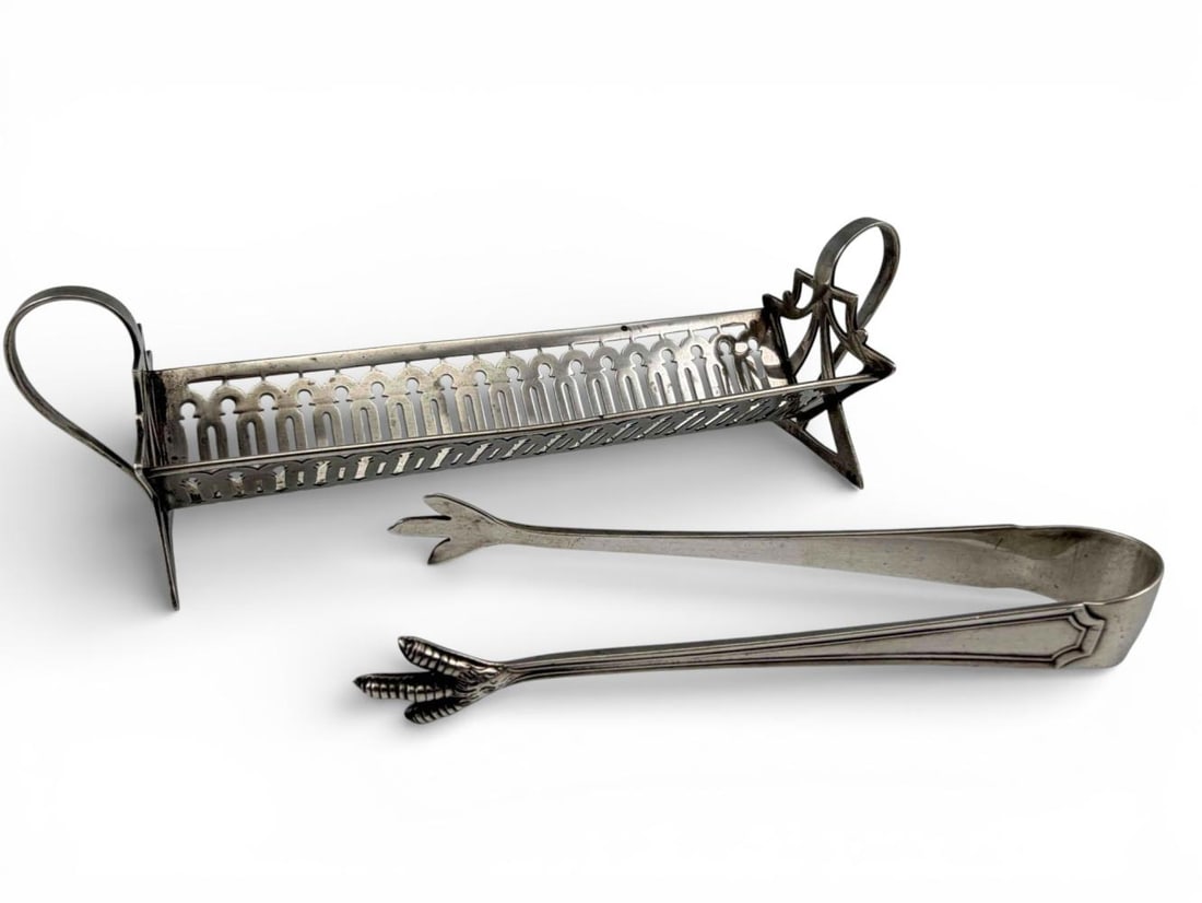 Sterling Silver Tongs & Sugar Cube Holder: Sterling Silver Tongs & Sugar Cube Holder, 68.7g. Marked "Sterling." Tongs approximately 4.5L x 0.62W in. Sugar cube holder approximately 6.5L x 1.75W x 1.87H in. ALL CREDIT CARDS WILL BE MANUALLY
