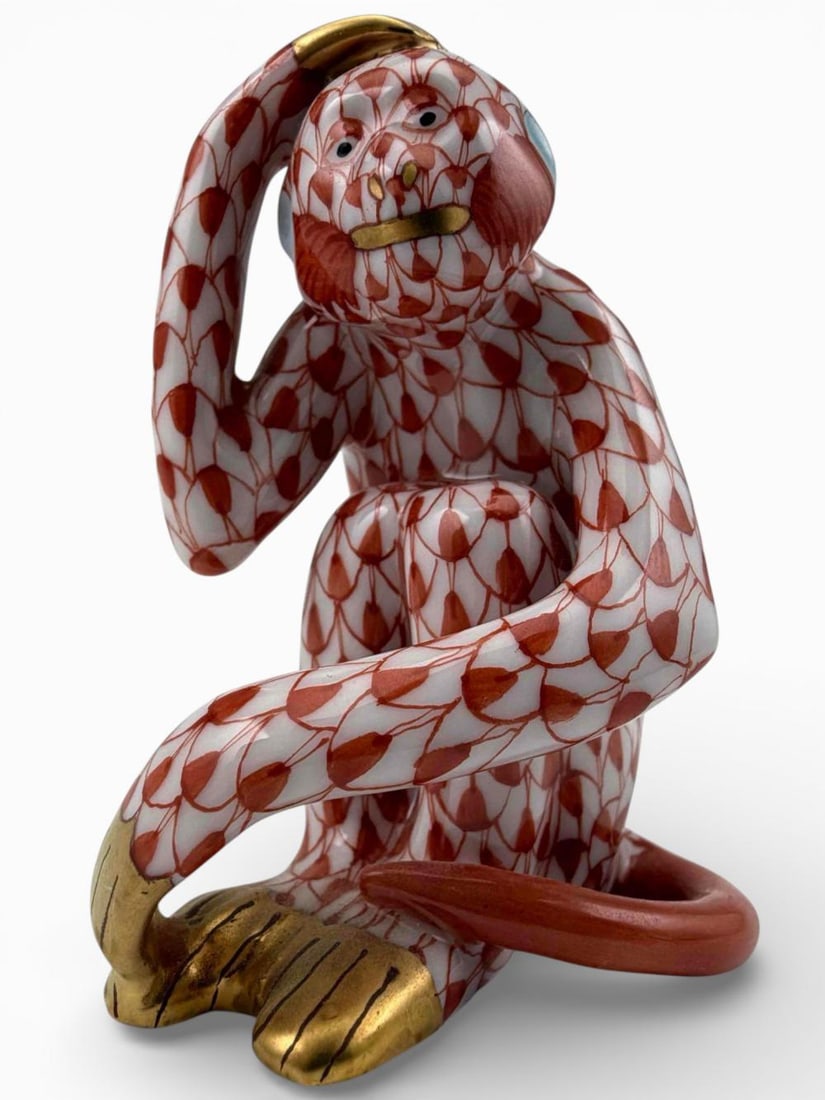 Herend Rust Fishnet Porcelain Monkey Figure: Herend Rust Fishnet Porcelain Monkey Figure. Marked "Herend Hungary handpainted." Proceeds from this lot benefit Grey Bears Nonprofit Organization. Grey Bears improves the health and well-being of