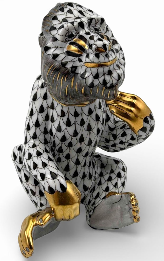 Herend Black Fishnet Porcelain Baboon: Herend Black Fishnet Porcelain Baboon Figure. Marked "Herend Hungary handpainted 15660.0.00 IVHNM J2002." Approximately 2.35W x 3.68H in. Proceeds from this lot benefit Grey Bears Nonprofit Organizati