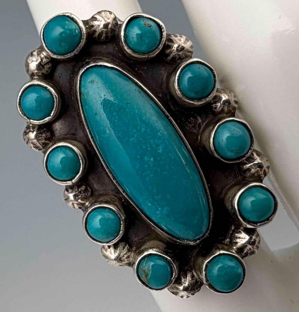 Running Bear, Navajo Sterling Silver Turquoise Ring: Running Bear, Navajo Sterling Silver Turquoise Ring, 11.3g. Signed "RB," in bear pictogram. Tests as sterling. Ring front approximately 34.6 x 21.9mm. Approximate ring size 6. Please note that winning