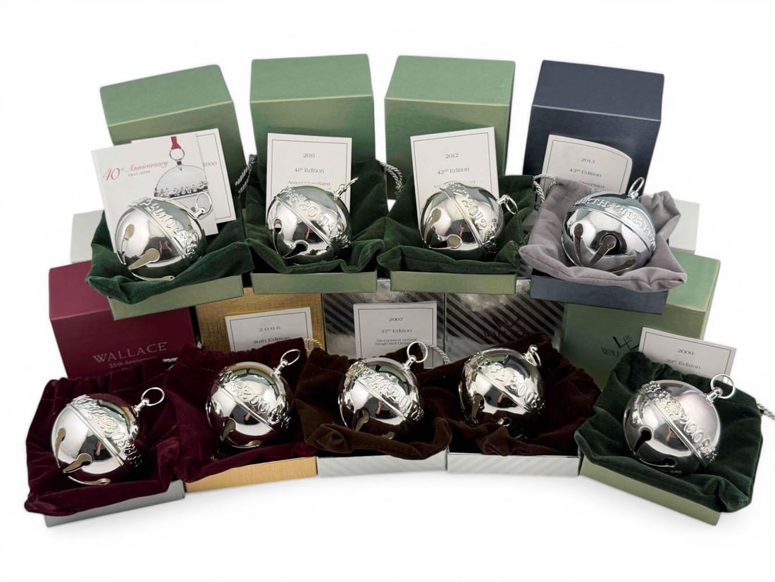 Wallace Silversmiths Annual Limited Edition Christmas Bells, 2005-2013: Wallace Silversmiths Annual Limited Edition Silverplate Christmas Bells, 2005-2013, Lot Of 9, With Original Boxes. Bells approximately 2.59in. Boxes approximately 3.75L x 3.68W x 2.73H in. Please