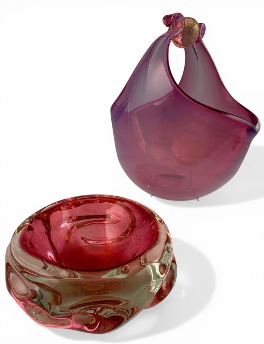 Two Murano Pink & Gold Fleck Art Glass Pieces: Two Murano Pink & Gold Fleck Art Glass Pieces. Basket form dish approximately 6.5H x 6.0L x 4.0W in. Bowl approximately 5.0L x 5.12W x 2.12H in. Please note that winning bidders are not required to se