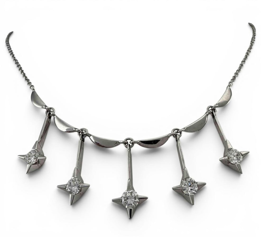 Mid Century 14K White Gold Diamond Star Necklace: Mid Century 14K White Gold Diamond Star Necklace, 6.4g. Marked "14K." Length approximately 15.12in.. Diamonds approximately 3.5mm. ALL CREDIT CARDS WILL BE MANUALLY VERIFIED PRIOR TO SHIPMENT.