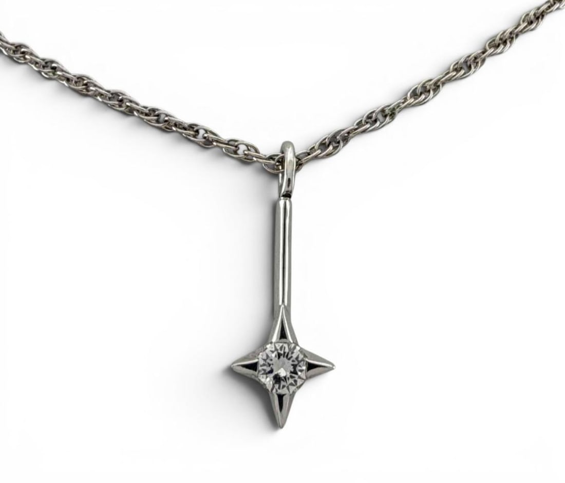 Mid Century 14K White Gold Diamond Star Necklace: Mid Century 14K White Gold Diamond Star Necklace, 3.7g. Marked "A Co 14K." Pendant approximately 20.6 x 7.3mm. Diamond approximately 3.5mm. Chain length approximately 18.0in. ALL CREDIT CARDS WILL BE