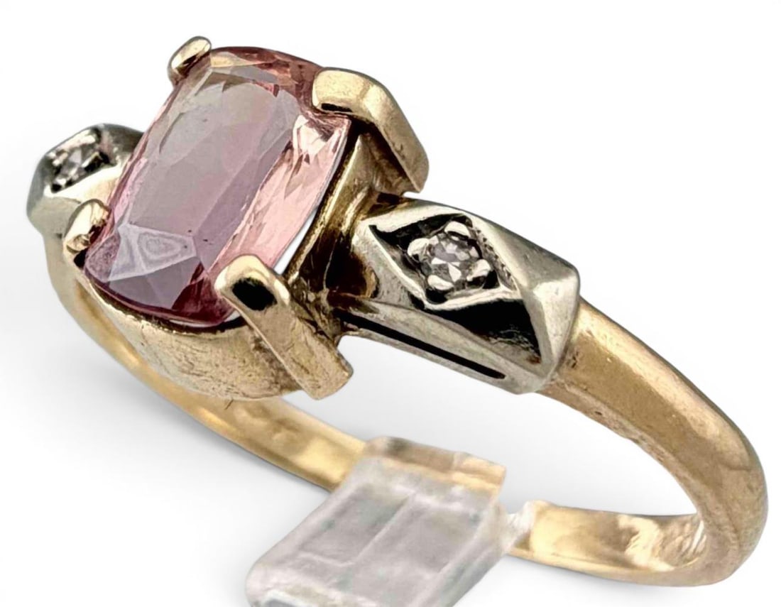 Vintage 14K Pink Topaz & Diamond Ring: Vintage 14K Pink Topaz & Diamond Ring, 2.4g. Marked "14K," signed illegibly. Topaz approximately 6.9 x 4.9mm. Approximate ring size 8. ALL CREDIT CARDS WILL BE MANUALLY VERIFIED PRIOR TO SHIPMENT.