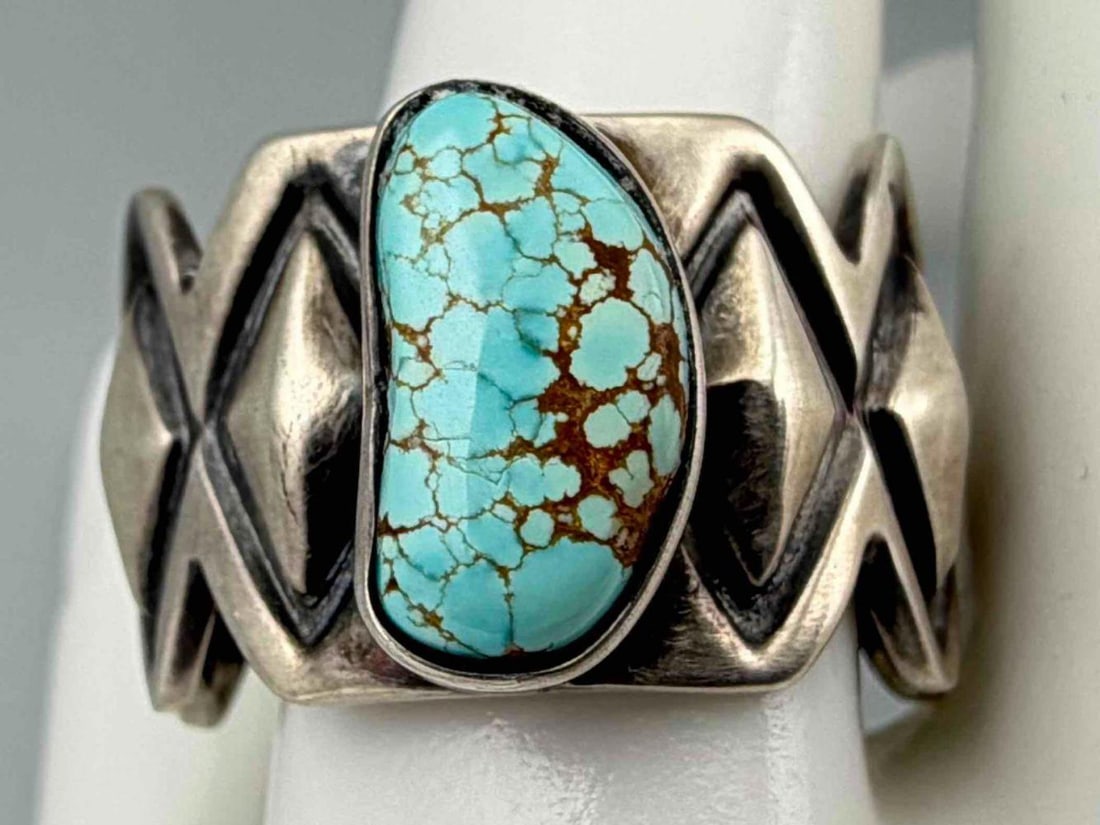 Ronnie Henry, Navajo Sterling Silver Turquoise Ring: Ronnie Henry, Navajo Sterling Silver Turquoise Ring, 11.9g. Marked "Sterling." Signed "Henry." Approximate rig size 12. Width approximately 15.0mm. Turquoise approximately 13.3 x 7.5mm.