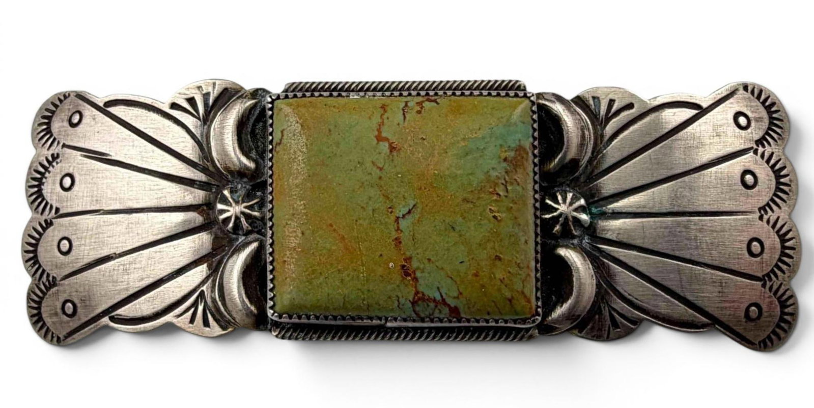 Navajo Hand Stamped Sterling Silver Turquoise Brooch: Navajo Hand Stamped Sterling Silver Turquoise Brooch, 15.5g. Marked "Sterling." Signed "M." Approximately 3.0L x 1.0W in. Turquoise approximately 21.8 x 18.7mm.