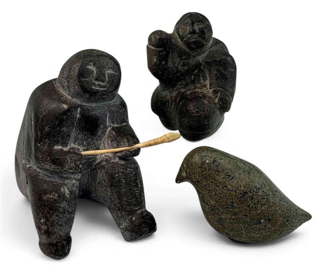 Group Of Inuit Stone Carvings, Including Martha Ikiperiak (1912-1979): Grouping Of Inuit Stone Carvings, Including Martha Ikiperiak (1912-1979). Tag affixed to underside of largest figure marked "#644 EP Ikiperiak." Largest approximately 5.0H x 6.12L x 2.75W in. Smaller