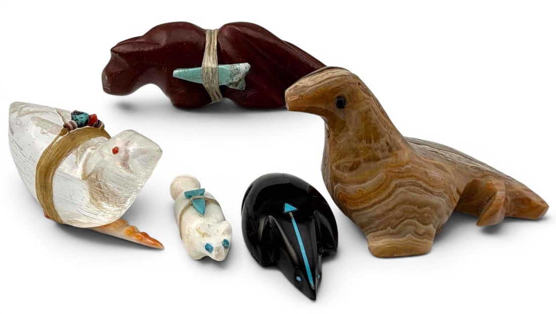 Grouping Of Zuni Carved Stone Fetishes: Grouping Of Zuni Carved Stone Fetishes. One signed Herb Halate. Largest approximately 2.75L x 1.54W x 1.75H in. Smallest approximately 1.5L x 0.55W x 0.47H in.