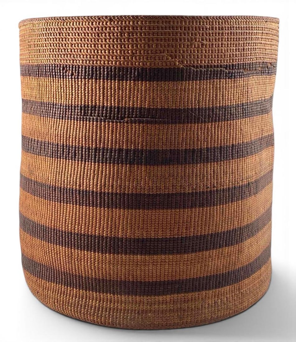 Large Northwest Coast Banded Basket, Possibly Tlingit: Large Native American woven basket with cylindrical form, braided rim detail, and repeating horizontal band design, attributed to the Tlingit peoples of the Pacific Northwest Coast. Approximately