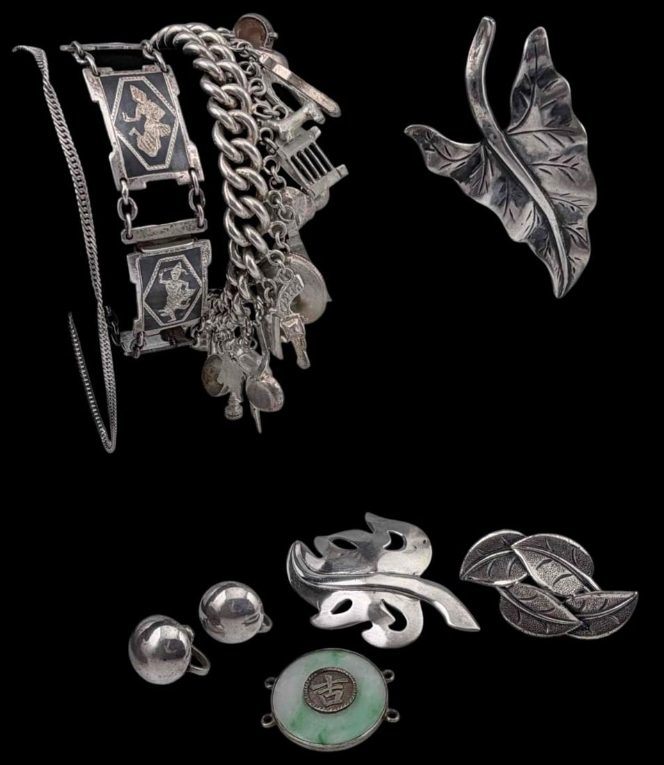 Grouping Of Vintage Silver Jewelry, Including Charm Bracelet: Grouping Of Vintage Silver Jewelry, Including Charm Bracelet. Sterling pieces (including charm bracelet), 102.0g. Jade pendant tests as 80 percent silver, 4.9g. Siam silver bracelet tests as 70 percen