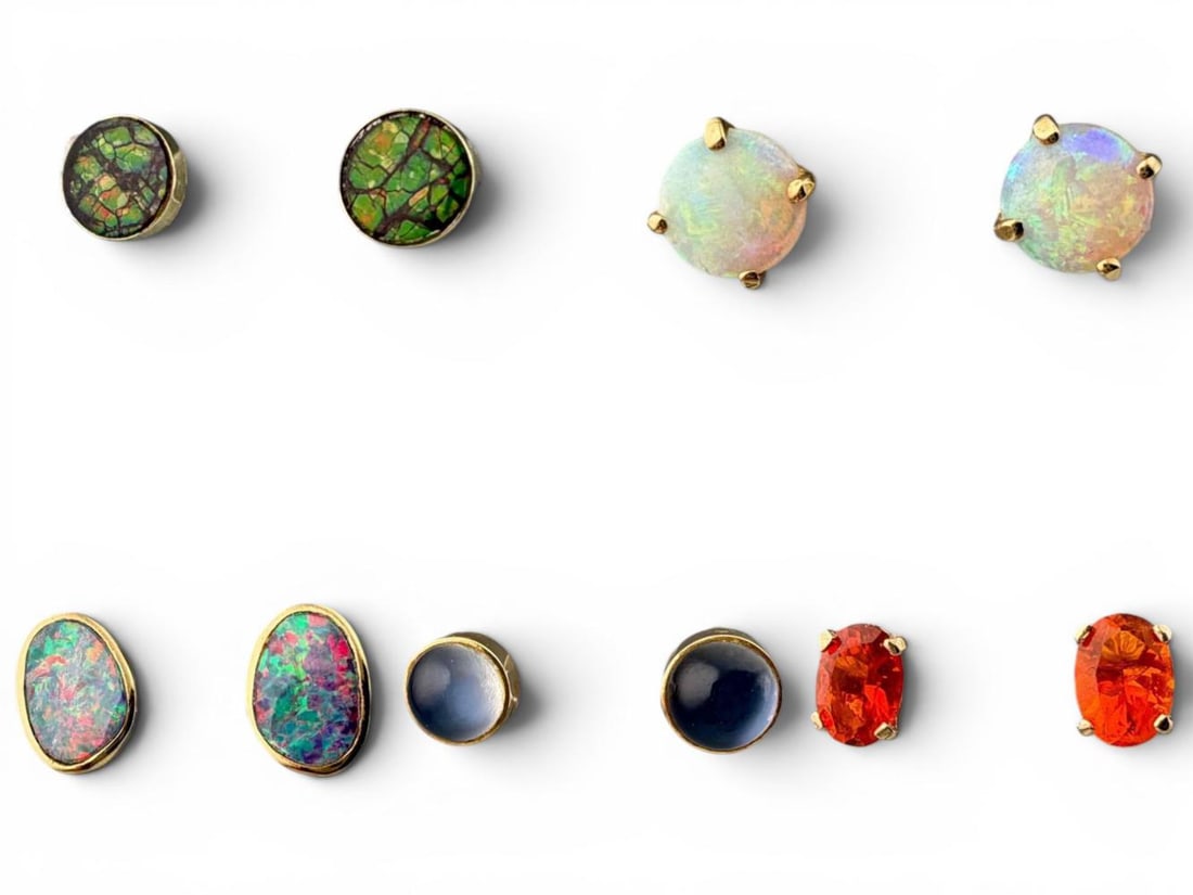 14K Opal & Moonstone Earrings: 14K Opal & Moonstone Earrings, 5.7g. Marked or test as 14K. Oval shaped opal earrings approximately 9.5 x 7.0W mm. Fire opal earrings approximately 6.8 x 4.9mm. Round opal earrings approximately