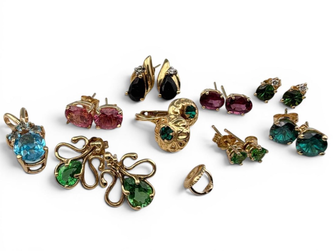 Lot Of 14K Gold Gem Set Jewelry: Lot Of 14K Gold Gem Set Jewelry, 14.8g. Pieces marked or test as 14K. Blue topaz pendant approximately 22.2L x 9.0W mm (including bale). Green tourmaline post earrings approximately 3.3mm. ALL CREDIT 