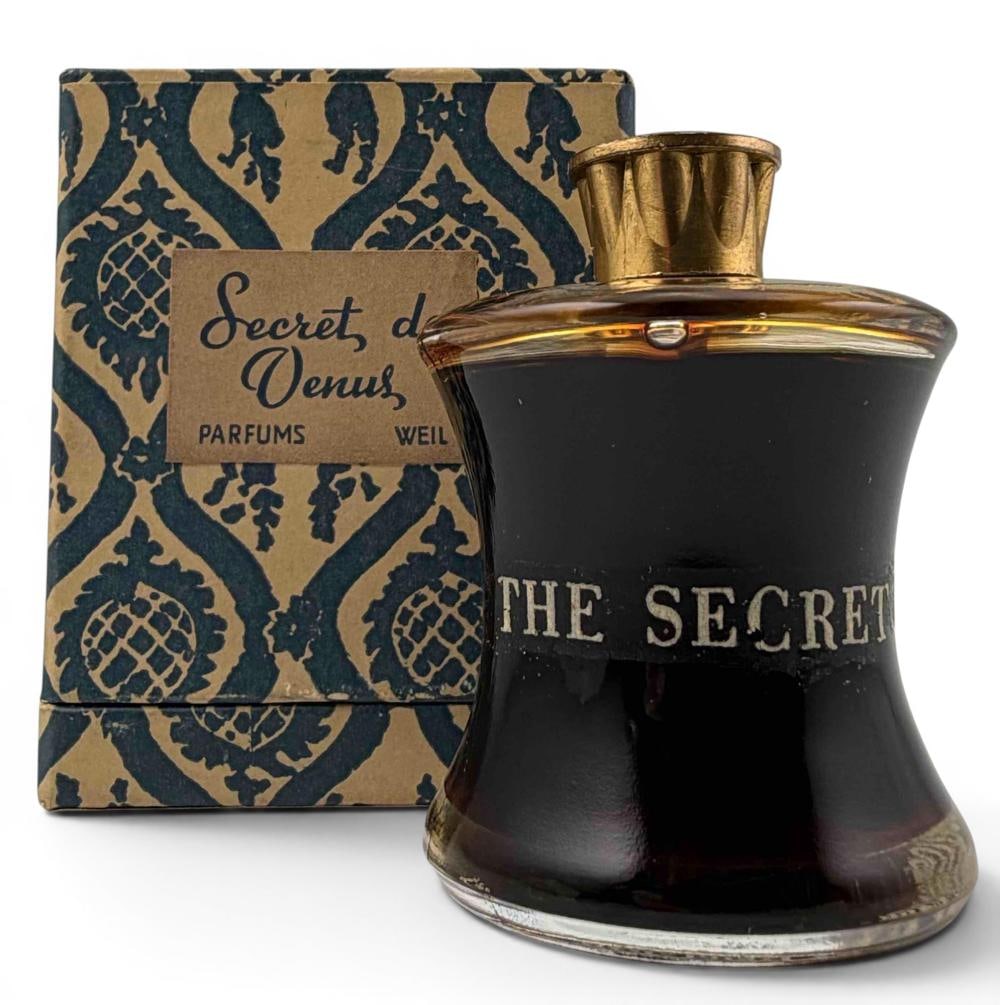 Weil Secret Of Venus Vintage Perfume Bottle & Box: Weil Secret Of Venus Vintage Perfume Bottle & Box. Marked "Parfums Weil Paris Co. Distributors New York, N.Y. Net Contents 1 fl. oz." Perfume bottle approximately 2.5H x 1.75W in. Box approximately 3.