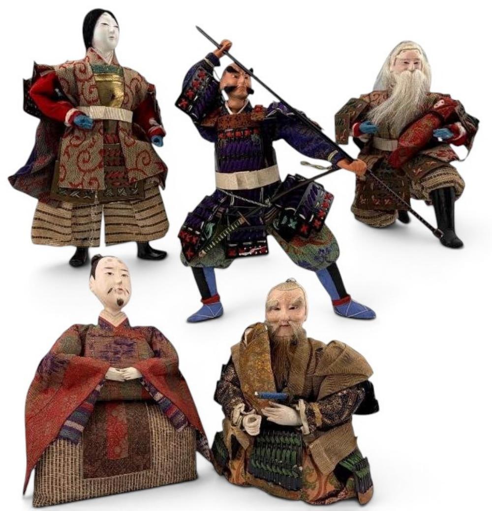Group Of Japanese Musha Ningyo (Samurai Dolls), 20th century: Group Of Japanese Ningyo (Samurai & Figure Dolls). Grouping includes a dynamic samurai warrior in armor, a standing court/warrior figure, and an elder figure holding a child (often associated with Tak