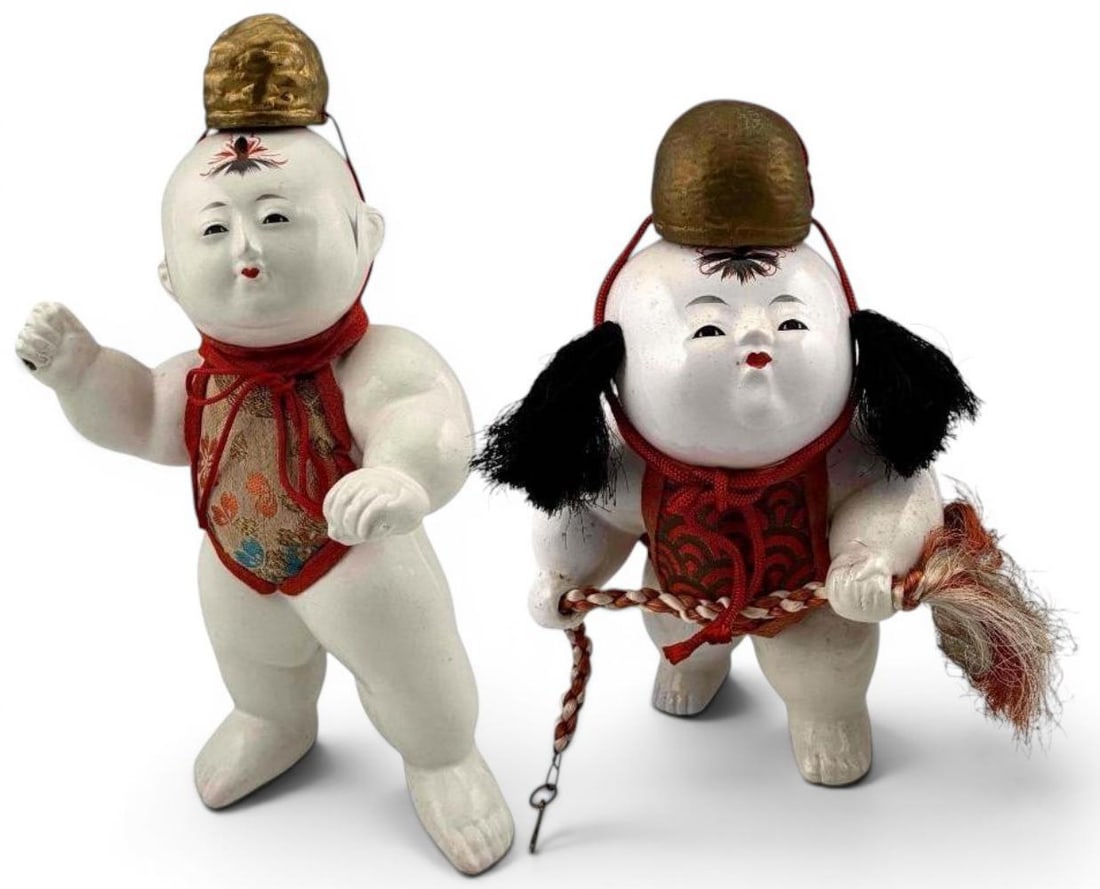 Two Japanese Gosho Ningyo Palace Dolls, Early-Mid 20th Century: Two Japanese Gosho Ningyo (Palace Doll) depicting plump children with finely painted features, featuring white gofun finish, and silk clothing. Approximately 10.5H x 5.75W x 4.0D in. and 8.37H x 5.5W 
