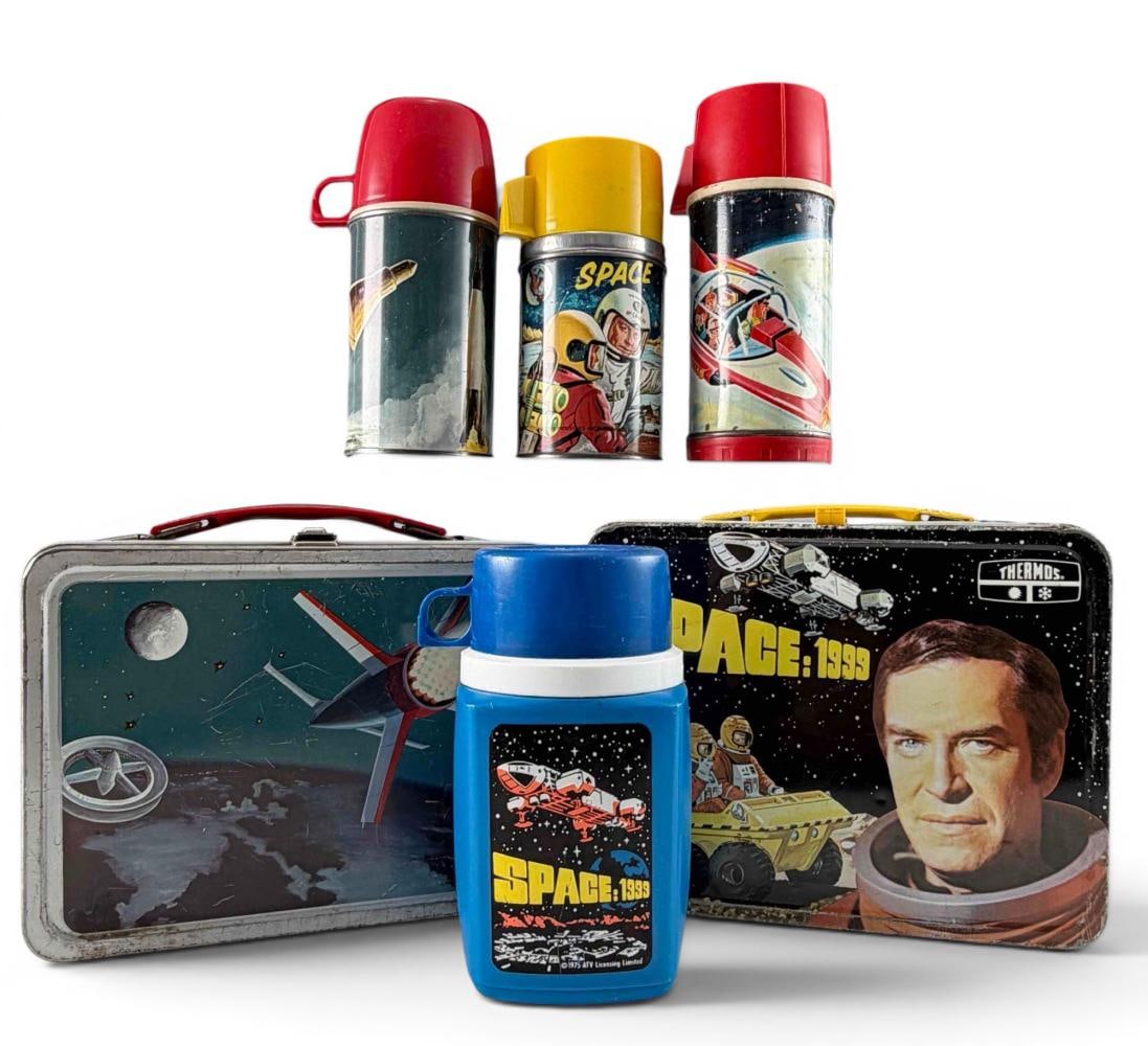 Vintage Space-Themed Lunchboxes & Thermoses: Vintage Space Themed Lunchboxes & Thermoses. Space: 1999 lunchbox approximately 8.75W x 7.5H x 4.0D in. Thermos brand rocket lunchbox approximately 8.75W x 7.0H x 3.62D in. Largest thermos approximate