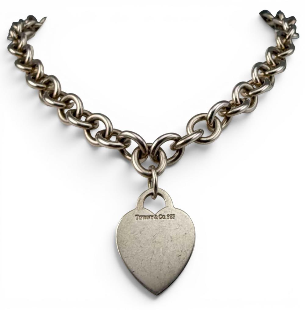 Tiffany & Co. Sterling Silver Heart Tag Necklace: Tiffany & Co. Sterling Silver Heart Tag Necklace, 66.9g. Marked "Tiffany & Co. 925." Necklace length approximately 16.0in. Heart pendant approximately 26.7 x 20.5mm. ALL CREDIT CARDS WILL BE MANUALLY 