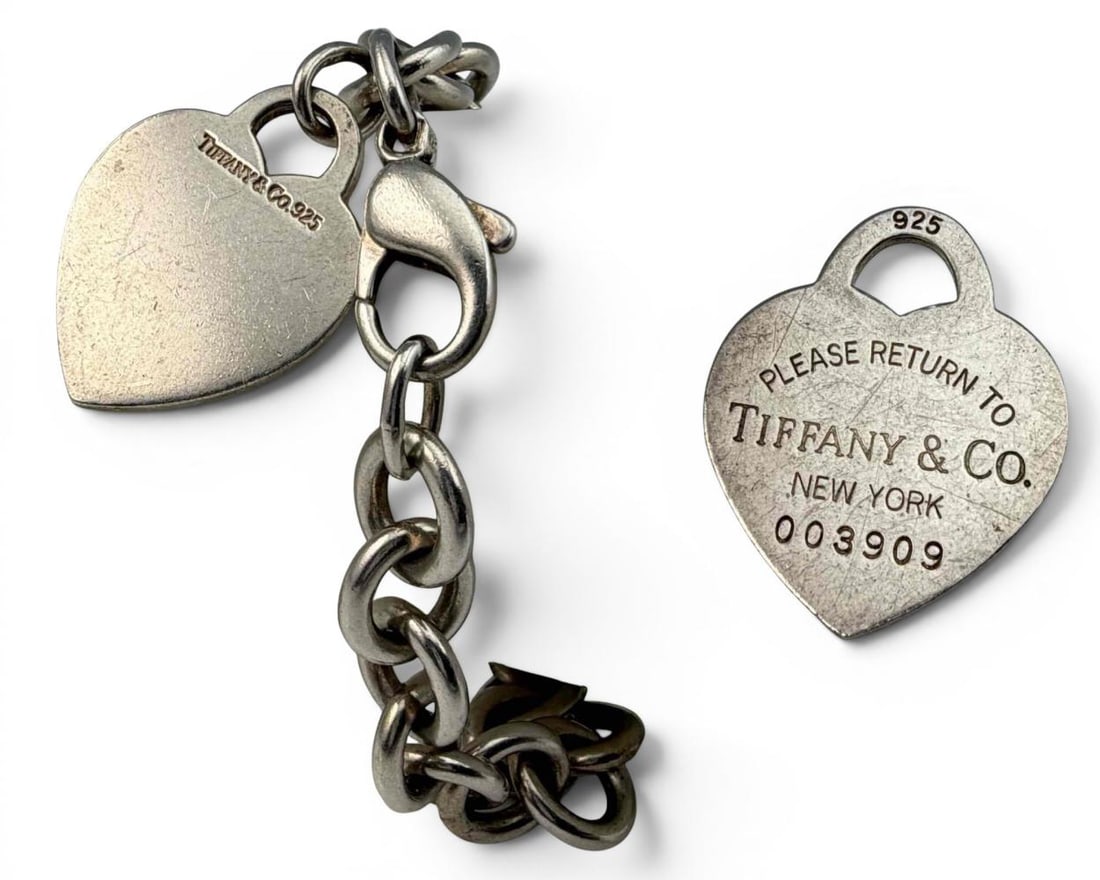 Tiffany & Co. Sterling Silver Heart Tag Bracelet And "Return To Tiffany" Pendant: Tiffany & Co. Sterling Silver Heart Tag Bracelet And "Return To Tiffany" Pendant, 43.4g total weight. Bracelet marked "Tiffany & Co. 925." Pendant marked "Please Return To Tiffany & Co. New York 00390