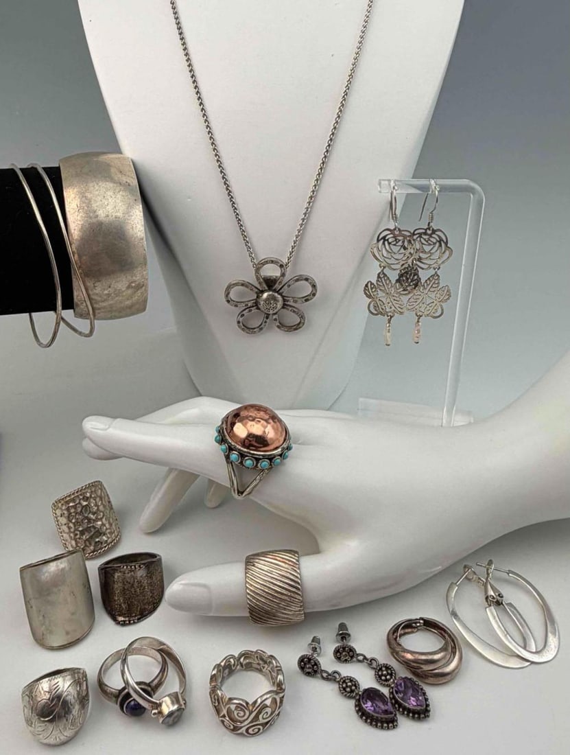 Grouping Of Sterling Silver Jewelry: Grouping Of Sterling Silver Jewelry, 150.6g. Pieces marked or test as sterling. Cuff bracelet inner cuff approximately 6.0in. Cuff break approximately 0.87in. Width approximately 1.0in. Approximate ri