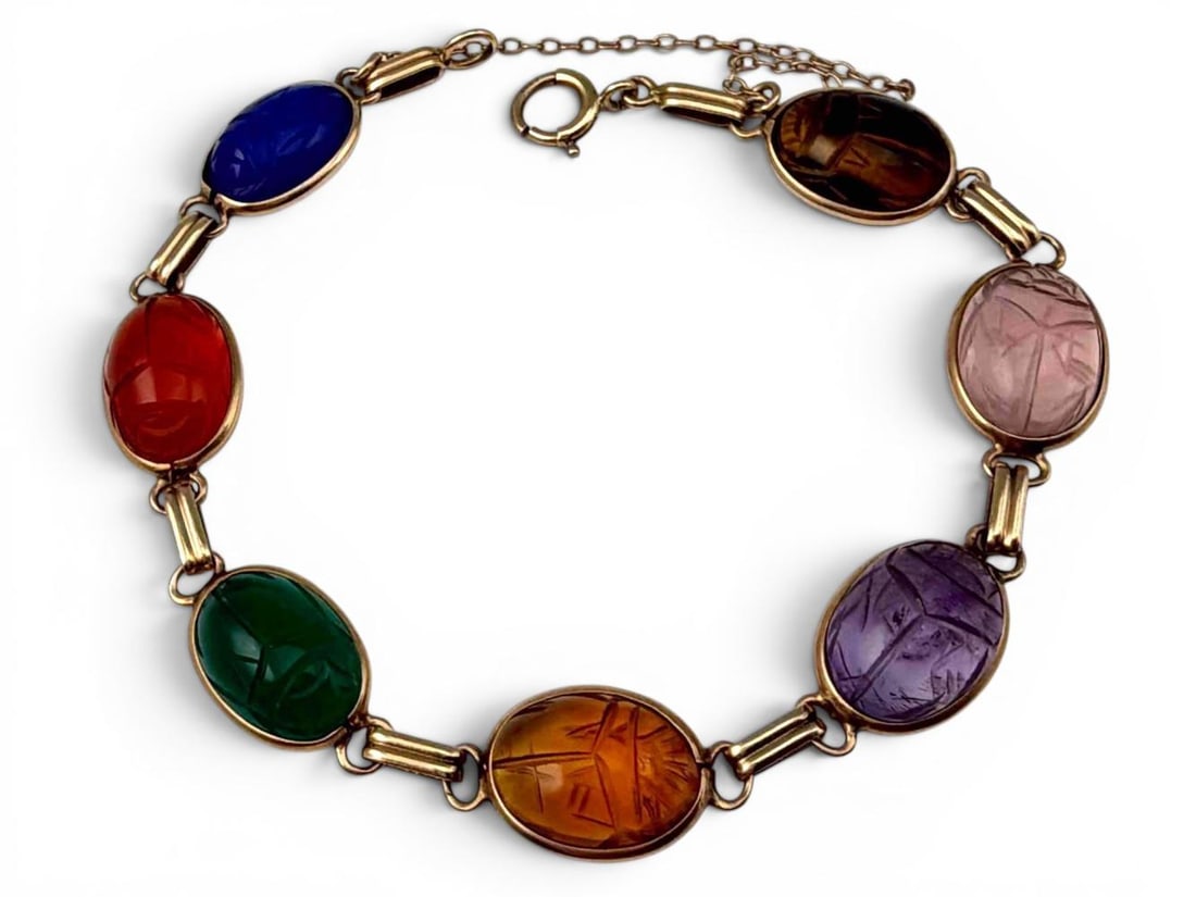 14K Gold Egyptian Revival Scarab Gemstone Bracelet: Vintage 14K gold multi-stone scarab bracelet, 11.5g, featuring carved oval gemstone scarabs, including amethyst, citrine, rose quartz, tiger's eye, carnelian, and additional colored stones. Marked 14K