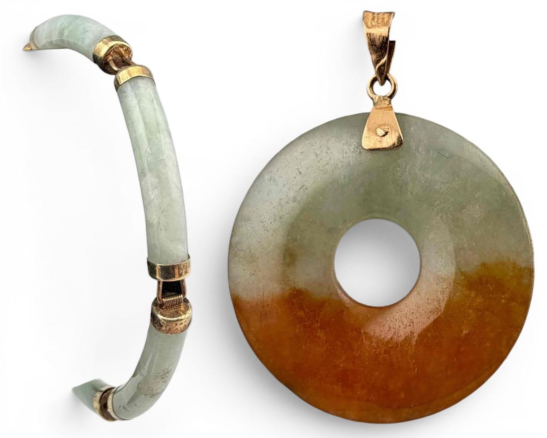 Chinese Jade Bracelet In 10K Gold & Jade Pendant In 14K Gold: Chinese 10K Jade Bracelet And 14K Jade Pendant. Bracelet 10.4g. Pendant 3.2g. Bracelet clasp marked "10K." Bale of pendant marked "585." Bracelet inner circumference approximately 6.5in. Width approxi