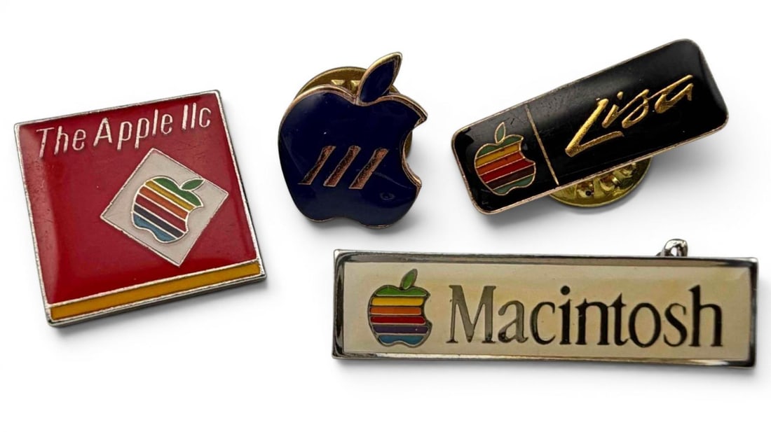 Grouping Of Vintage Apple Computers Lapel Pins, Including Apple Lisa: Grouping Of Vintage Apple Computers Lapel Pins, Including Apple Lisa. Largest approximately 17.5 x 17.5mm. "Lisa" pin approximately 22.5 x 8.5mm.