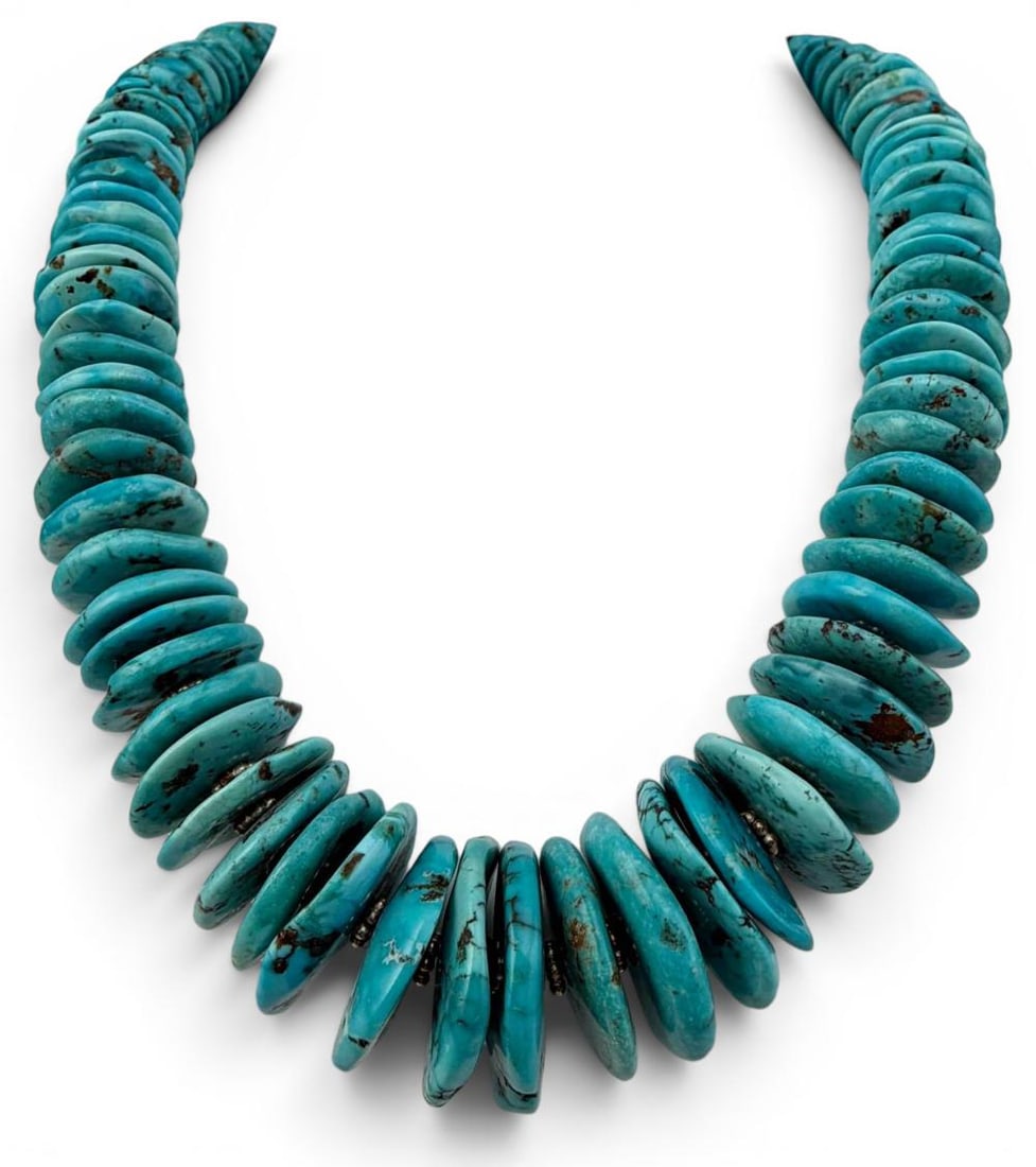 Sterling Silver Turquoise Necklace: Sterling Silver Turquoise Necklace, 205.4g. Unmarked, silver beads and clasp test as sterling. Length approximately 26.5in. Largest disk shaped bead approximately 23.0 x 4.9mm.