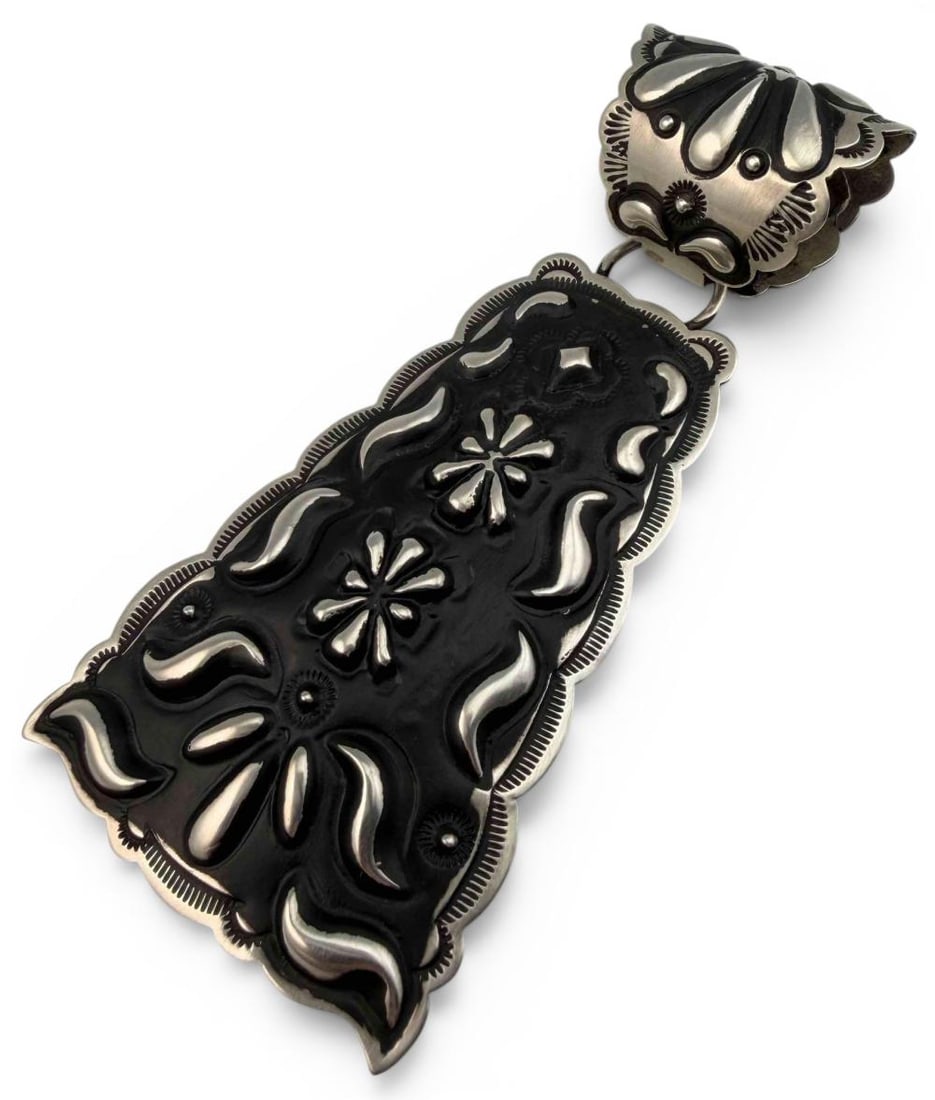 Leander Tahe, Large Navajo Hand Stamped Sterling Silver Pendant: Leander Tahe, Native American Hand Stamped Sterling Silver Pendant, 28.4g. Signed "L. Tahe." Marked "Sterling." Approximately 4.25L x 1.89W in. (including bale).