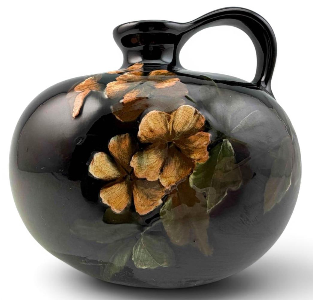 Weller Louwelsa Pottery Jug: Weller Louwelsa Pottery Jug. Marked "Louwelsa Weller 879." Approximately 4.75H x 5.50L x 4.25W in.