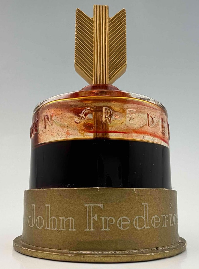 John Frederics New York Golden Arrow Perfume Bottle, c. 1935: John Frederics New York Golden Arrow Perfume Bottle, C. 1935. Approximately 4.5H x 2.41W in. Provenance: From the collection of Louise Lyson Bulgheroni Forster, born in Monaco in 1896 into a prominent