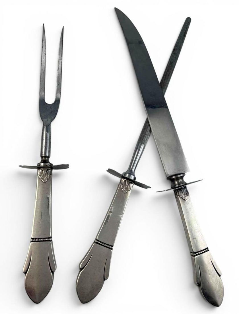 Towle Fleur De Lis Sterling Silver Handled Carving Set: Towle Fleur De Lis Sterling Silver Handled Carving Set. Marked "Sterling Handle." Knife approximately 12.5L x 1.75W in. Fork approximately 10.25L x 1.75W in. Honing rod approximately 12.75L x 1.75W in