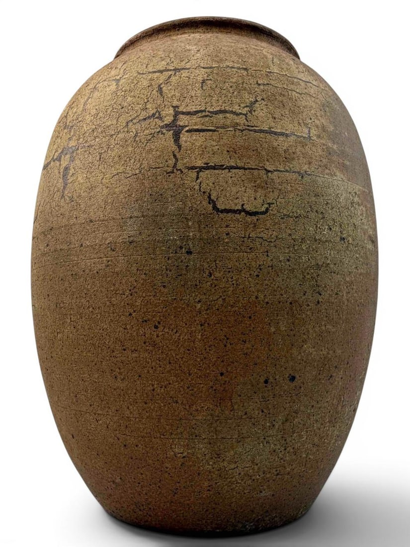 Asian Pottery Stoneware Jar with Incised Signature: Asian pottery stoneware jar of rounded form with earthy brown surface, and mottled ash/flashing-style decoration. The underside bears an incised inscription and impressed seal mark.