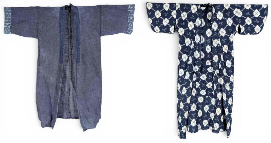 Two Vintage Japanese Indigo Cotton Kimono With Kasuri Patterns: Two vintage Japanese indigo cotton kimono, including one dark blue textured woven kimono with patterned kasuri trim at the sleeves and one navy and white allover kasuri patterned kimono.