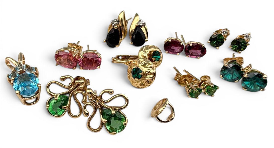 Lot Of 14K Gold Gem Set Jewelry: Lot Of 14K Gold Gem Set Jewelry, 14.8g. Pieces marked or test as 14K. Blue topaz pendant approximately 22.2L x 9.0W mm (including bale). Green tourmaline post earrings approximately 3.3mm. ALL CREDIT 