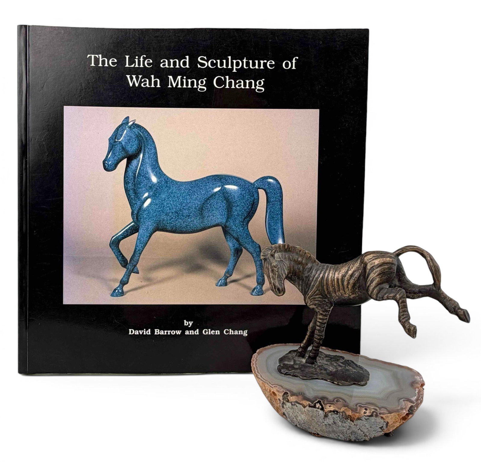 Wah Ming Chang (1917-2003), Zebra, Bronze Sculpture On Agate Base With Signed Book: Wah Ming Chang, bronze zebra sculpture mounted on a natural agate slice base. Signed and titled at underside "Zebra / Wah Chang." Offered together with the autographed book The Life and Sculpture of