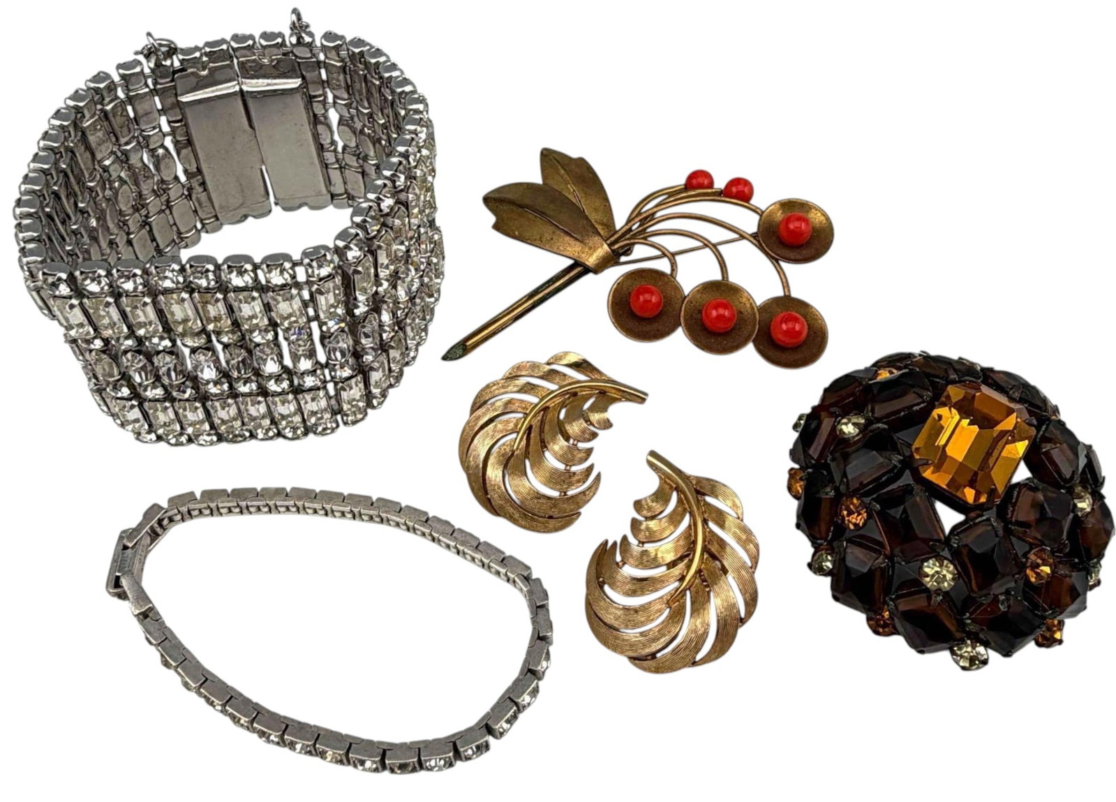 Vintage Costume Jewelry Including Schreiner, Trifari: Vintage Costume Jewelry Including Schreiner, Trifari. Rhinestone brooch marked "Schreiner New York," Ear clips marked "Trifari," smaller rhinestone bracelet marked "Otis Sterling." Larger rhinestone b