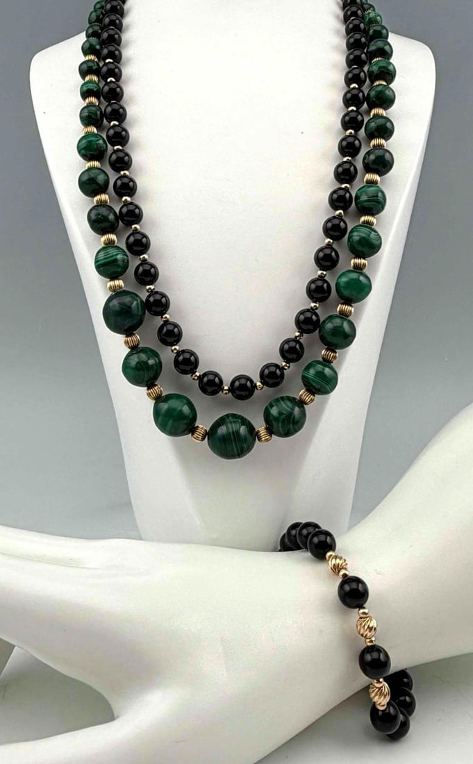 Group of Malachite, Black Onyx and 14K Gold Bead Jewelry: Group of Malachite, Black Onyx and 14K Gold Bead Jewelry. Group comprising a black onyx bead necklace and matching bracelet accented with 14K gold beads and fittings, and a graduated malachite bead