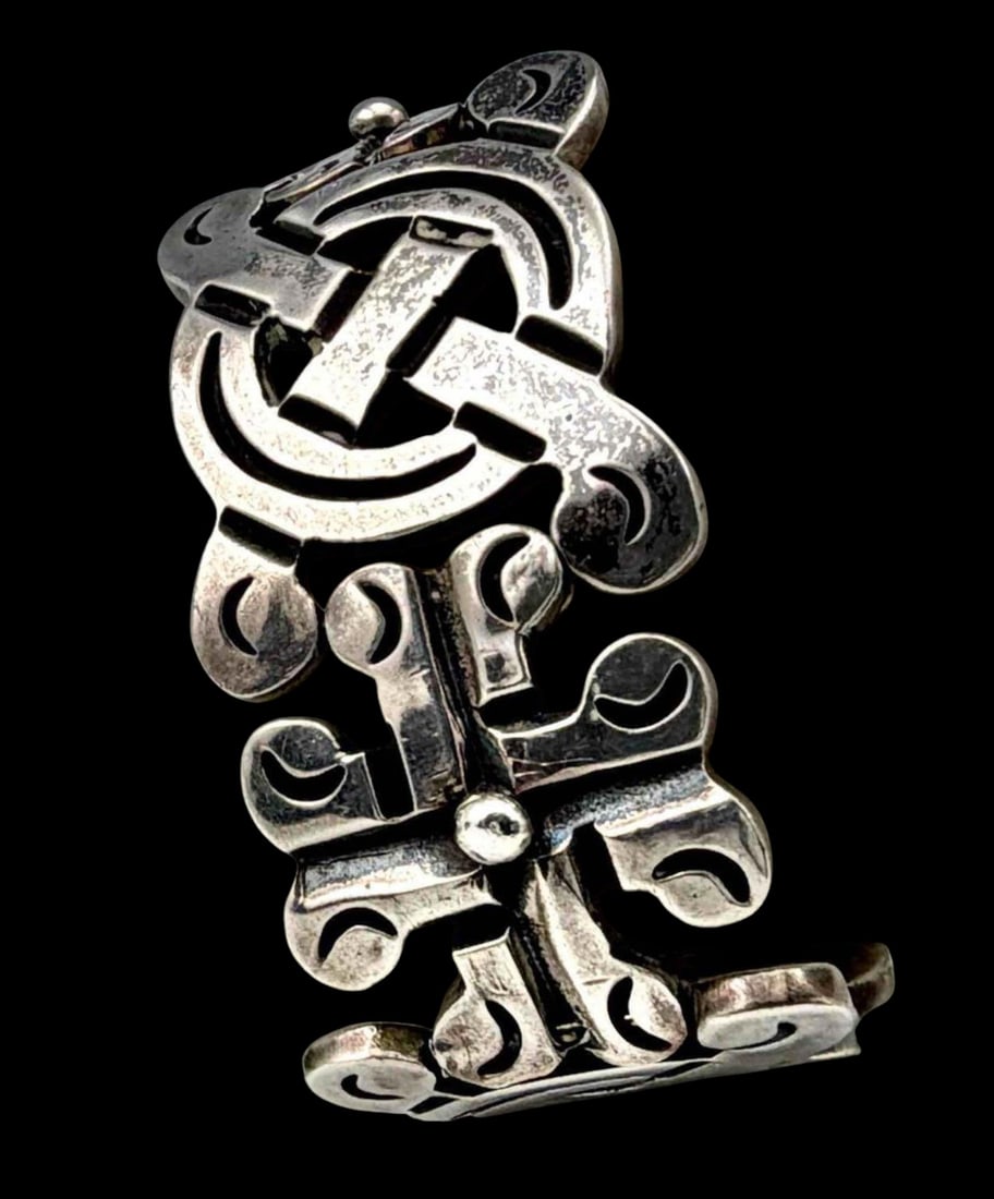 Vintage Taxco Sterling Silver Bracelet: Vintage Taxco Sterling Silver Bracelet, 73.4g. Marked "Sterling Mexico." Inner circumference approximately 6.75in. Width approximately 0.93in.
