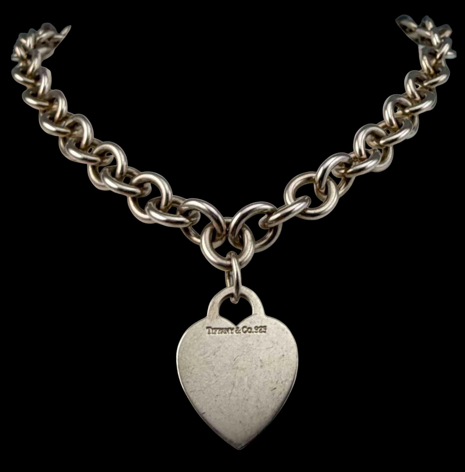 Tiffany & Co. Sterling Silver Heart Tag Necklace: Tiffany & Co. Sterling Silver Heart Tag Necklace, 66.9g. Marked "Tiffany & Co. 925." Necklace length approximately 16.0in. Heart pendant approximately 26.7 x 20.5mm. ALL CREDIT CARDS WILL BE MANUALLY 